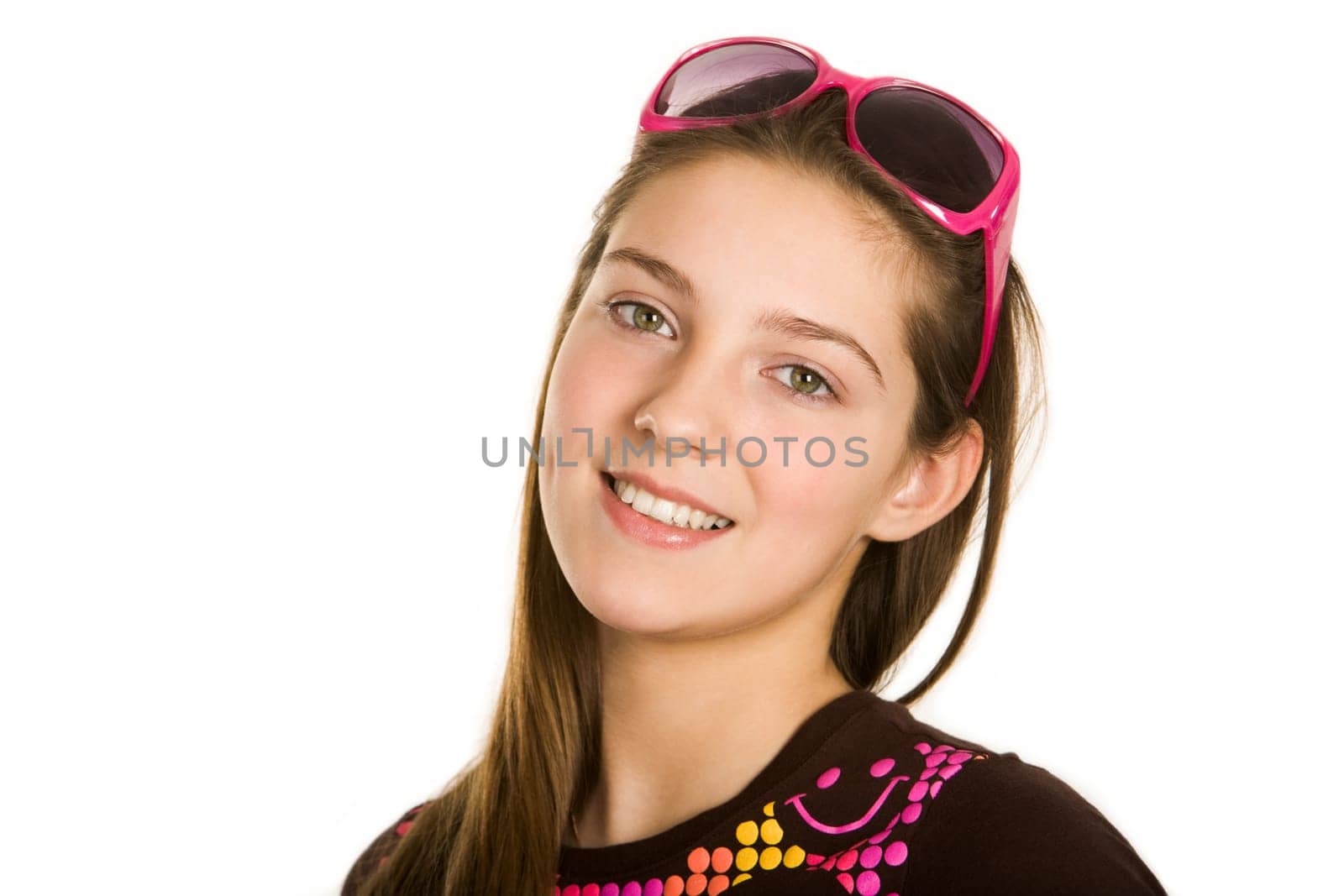 Face of pretty girl looking at camera with smile over white background