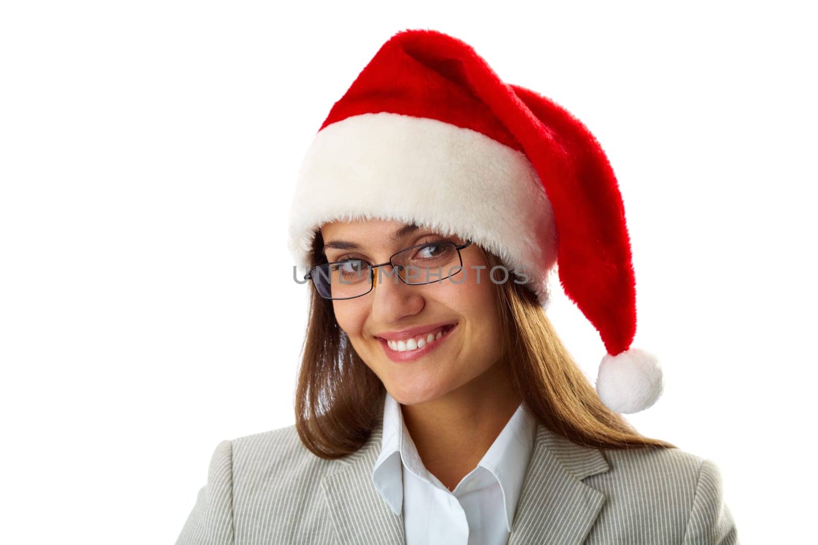 Portrait of happy businesswoman in Santa cap smiling at camera
