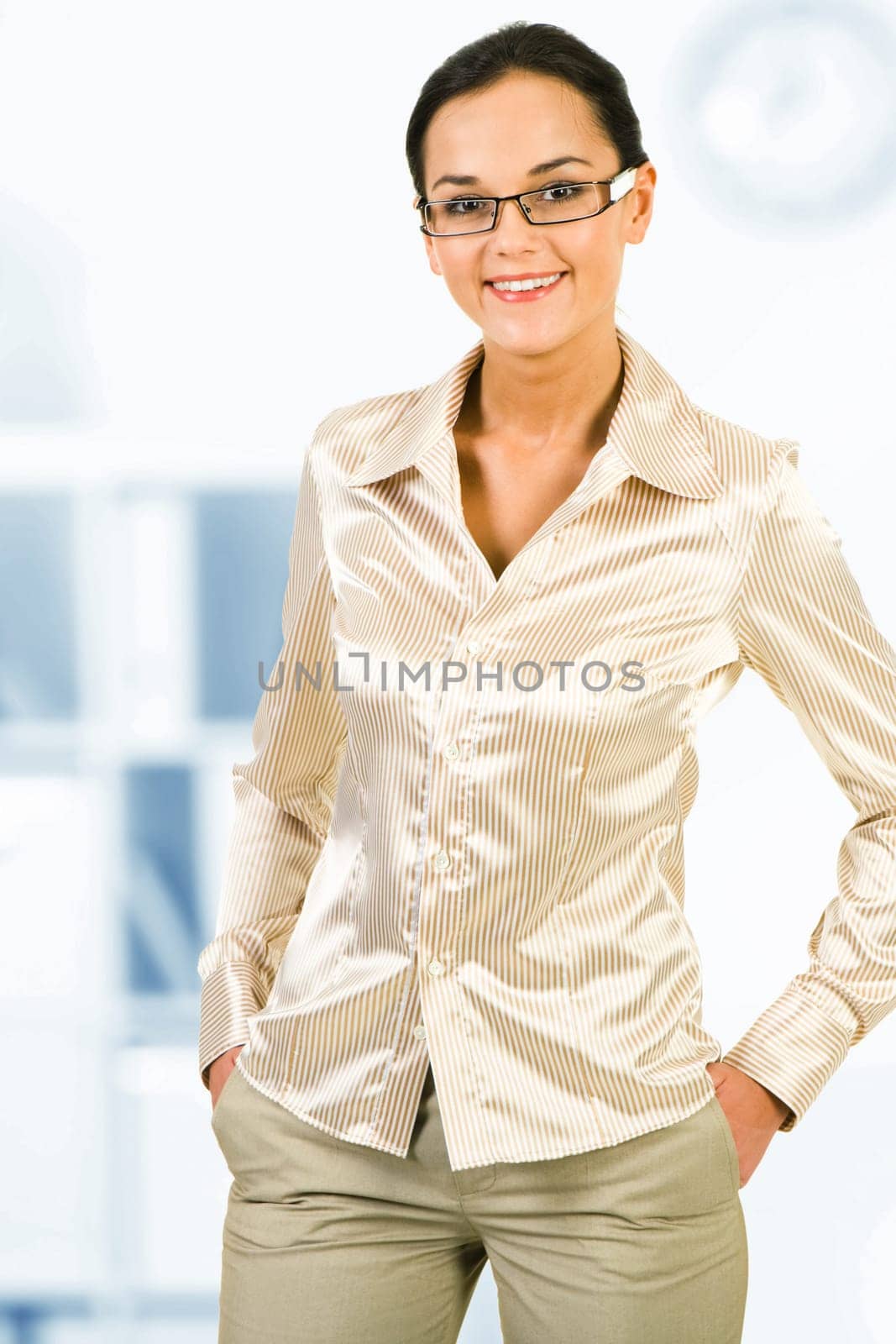 Portrait of pretty white collar worker looking at camera in office