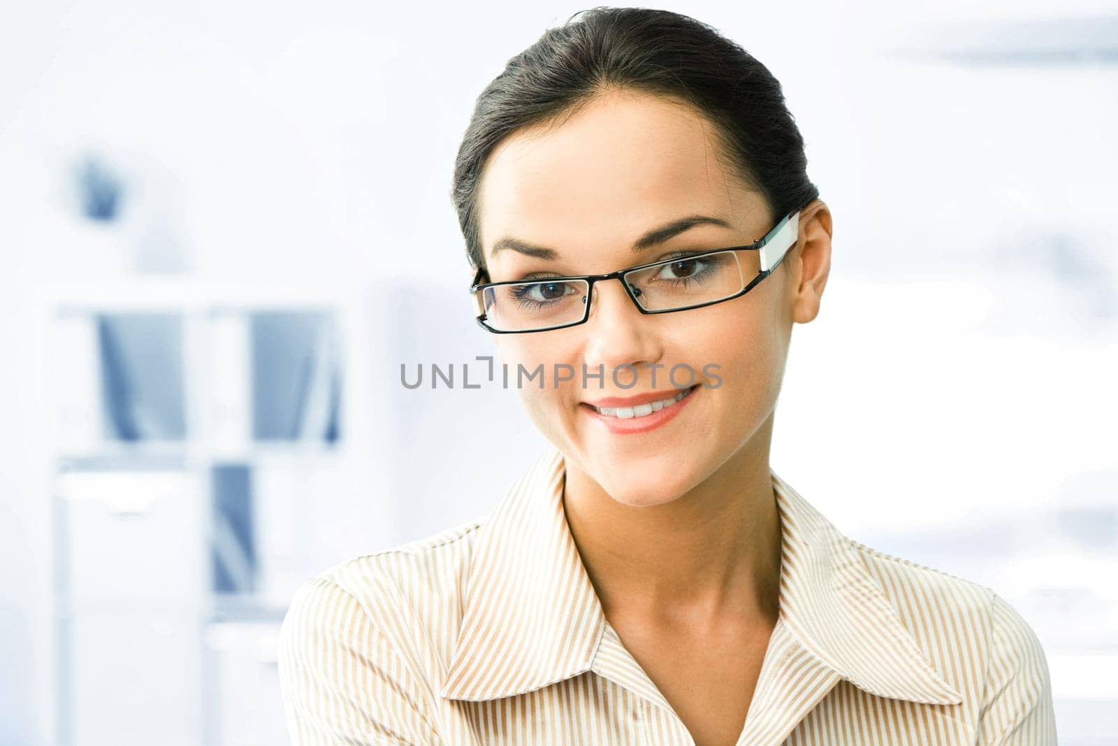 Face of clever business woman in the office