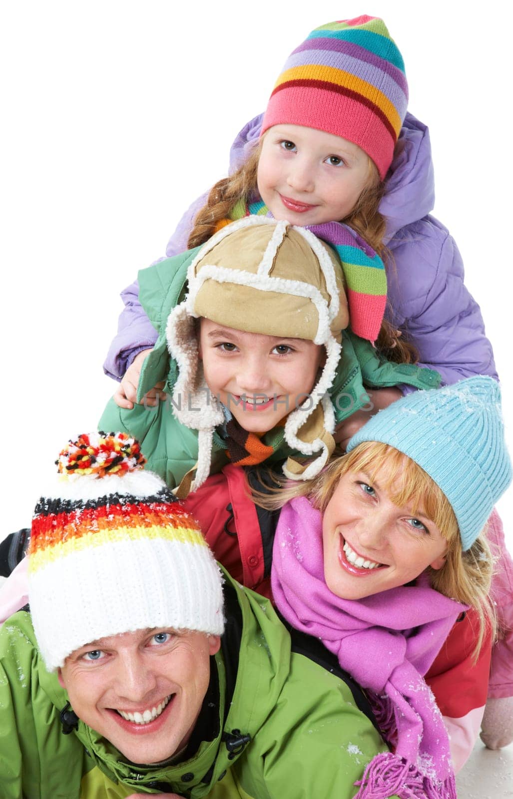 Heap of happy family members looking at camera with smiles