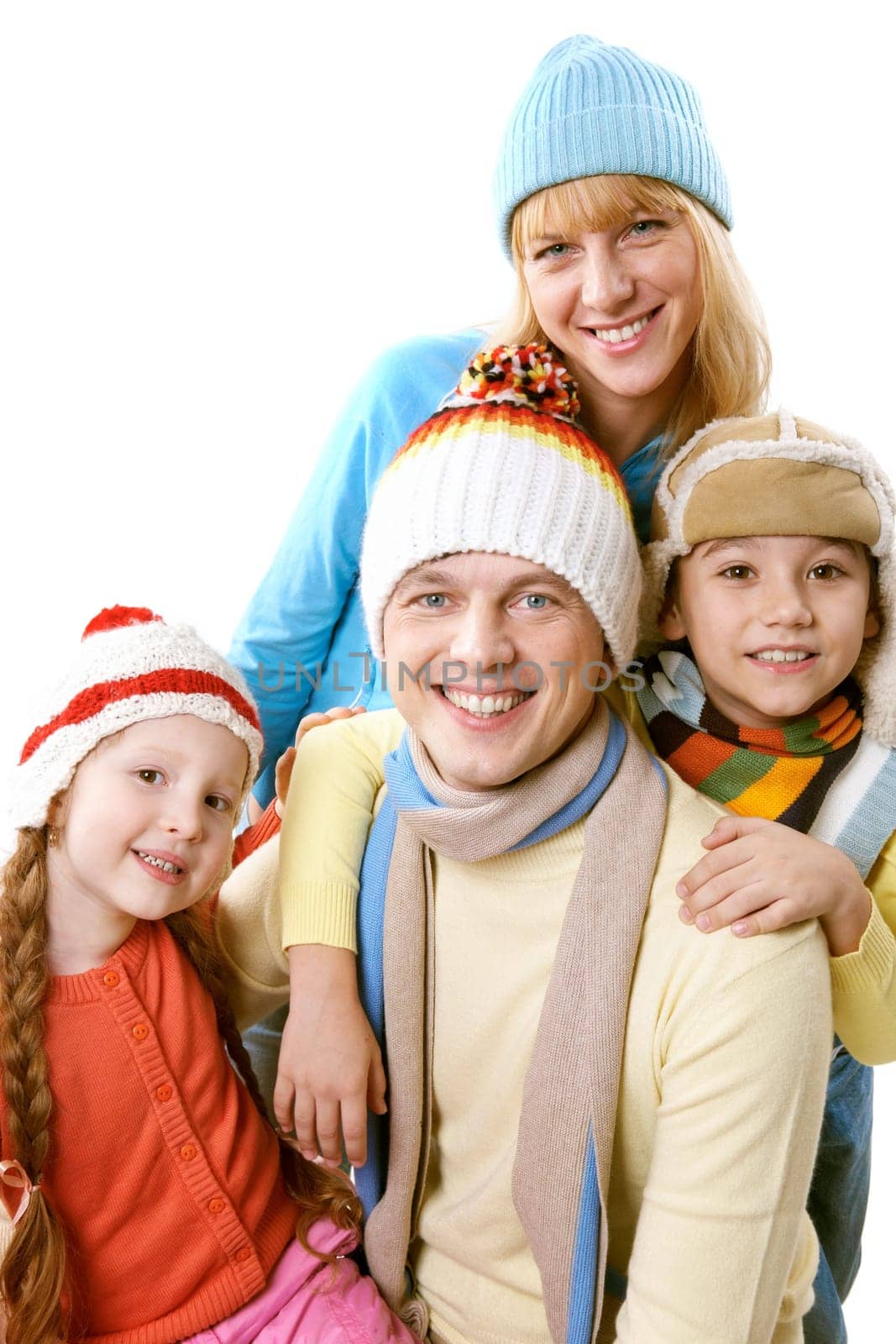 A happy family in winter clothing over white background