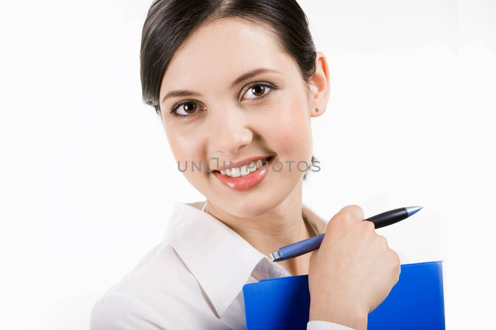 Image of successful professional holding pen in hand and looking at camera with smile
