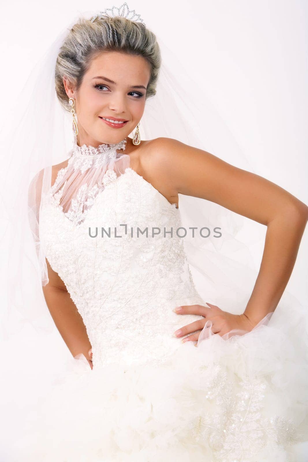 Portrait of beautiful smiling bride posing in isolation