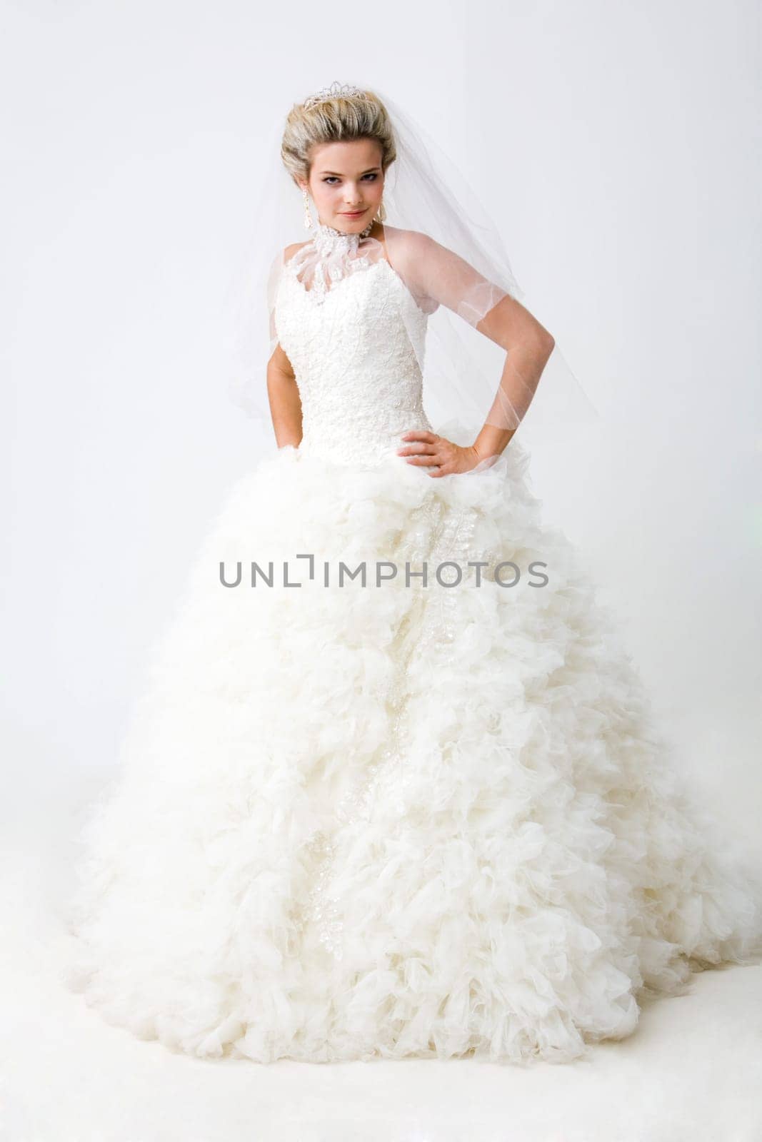 Portrait of charming marriageable looking at camera in the studio