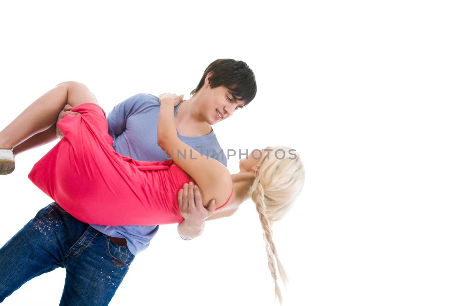 Image of beautiful blonde looking at handsome man while on his arms