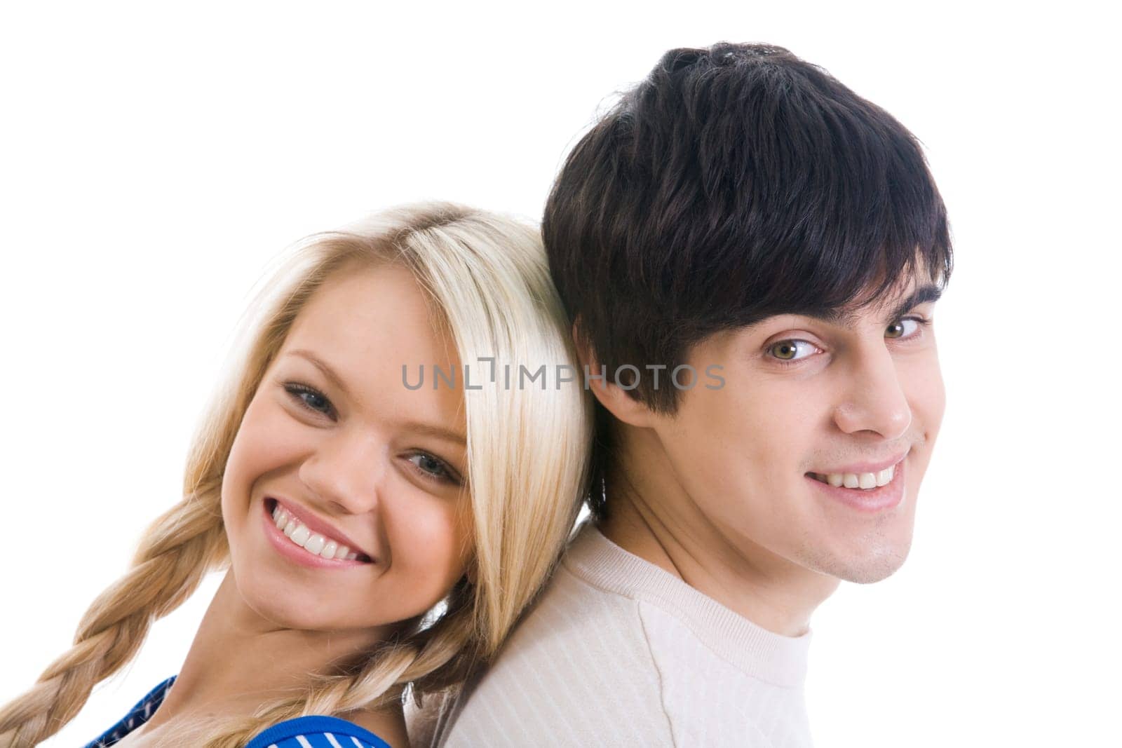 Happy couple looking at camera over white background