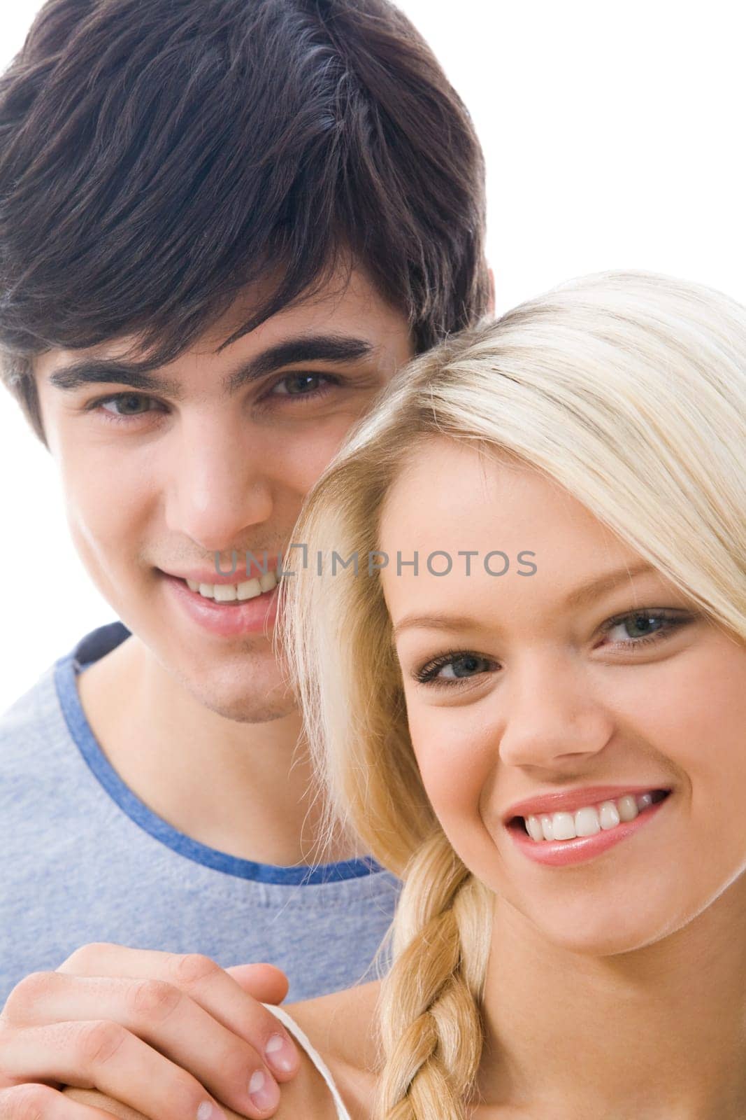 Face of beautiful blonde woman looking at camera on background of smiling man