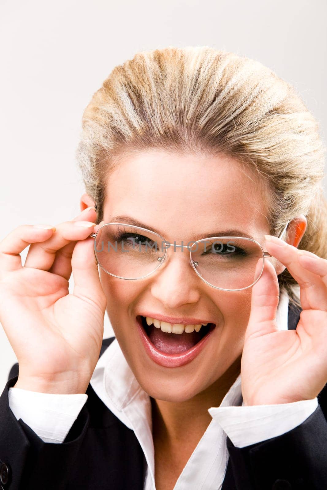 Vertical image of smart woman in suit looking at camera