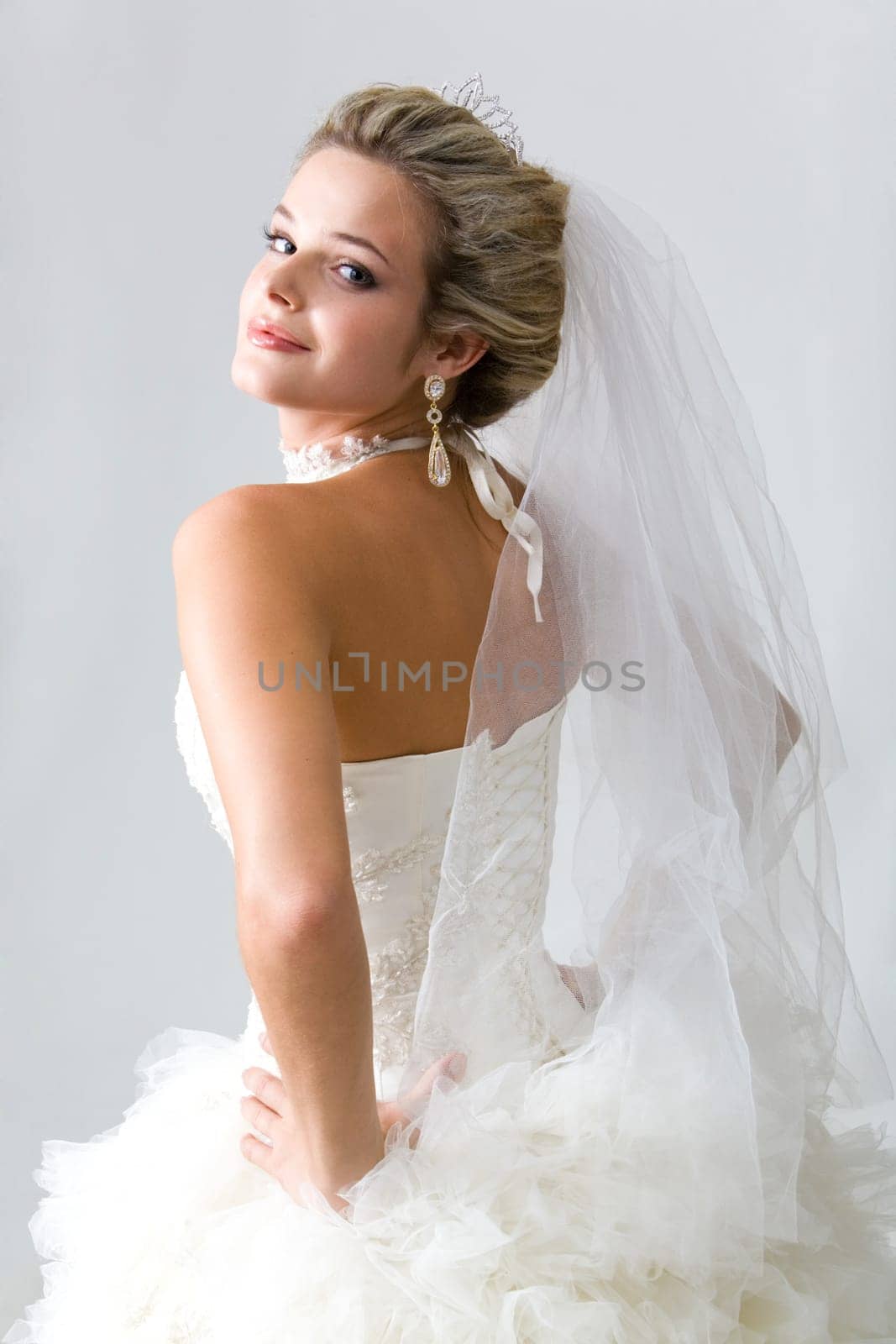Portrait of self-confident fiancee isolated on a grey background