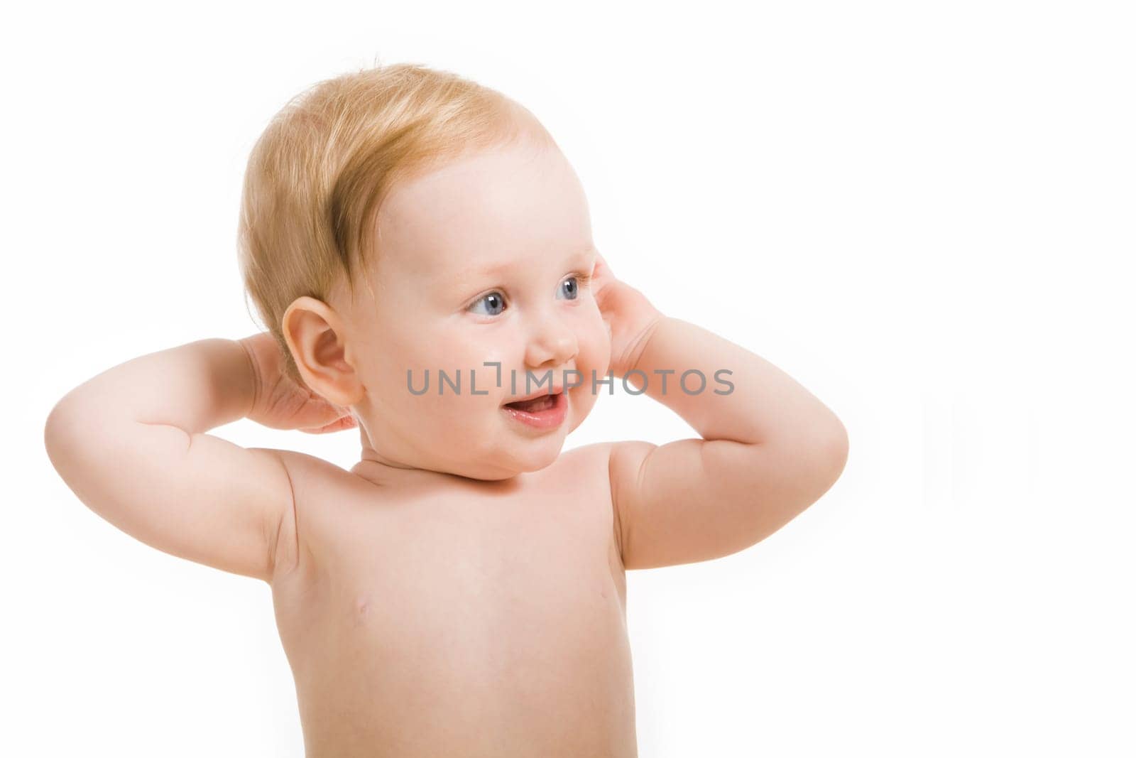 Photo of happy baby touching her head isolated on white background