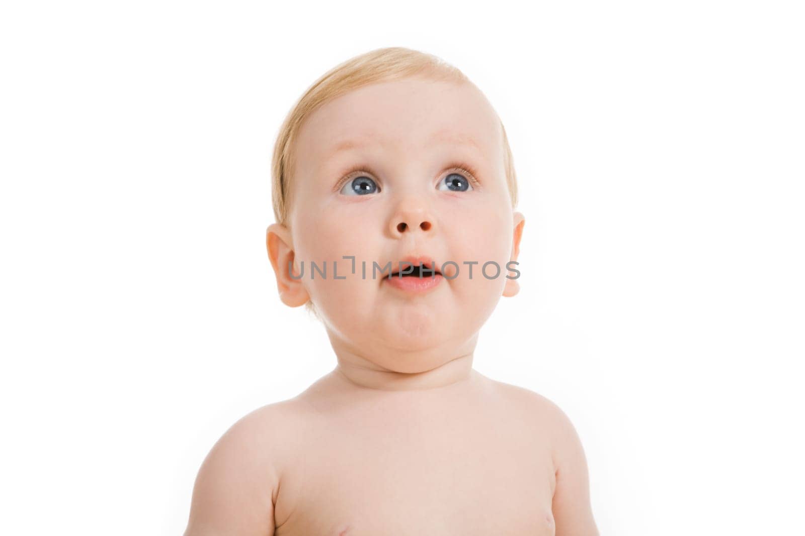 Portrait of cute little girl looking upwards with her mouth open