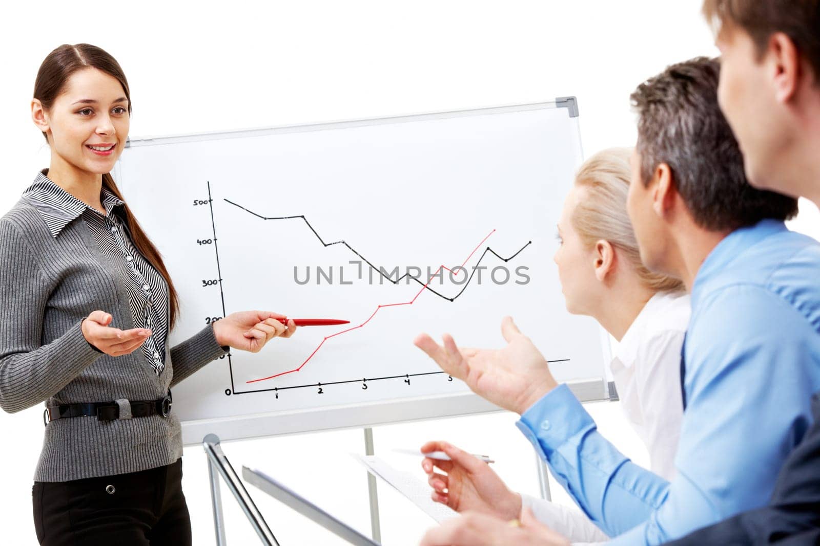 Image of smart business woman looking at their partners while she explaining something on whiteboard