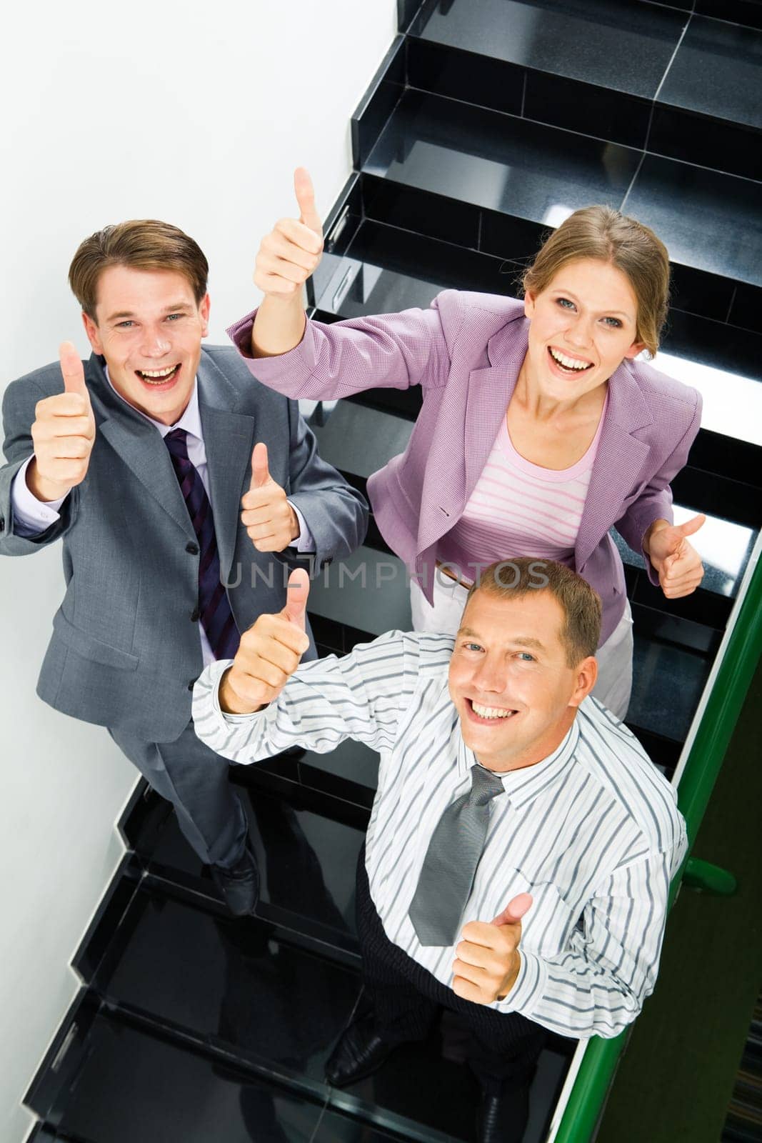 Portrait of businesspeople showing sign of okay