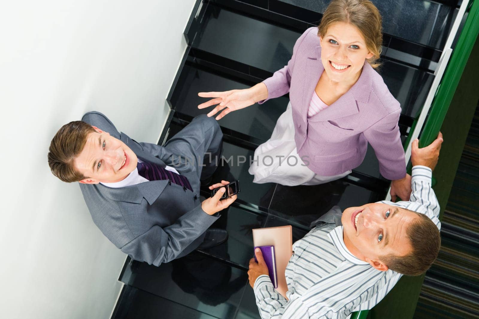 Image of business partners standing on staircase