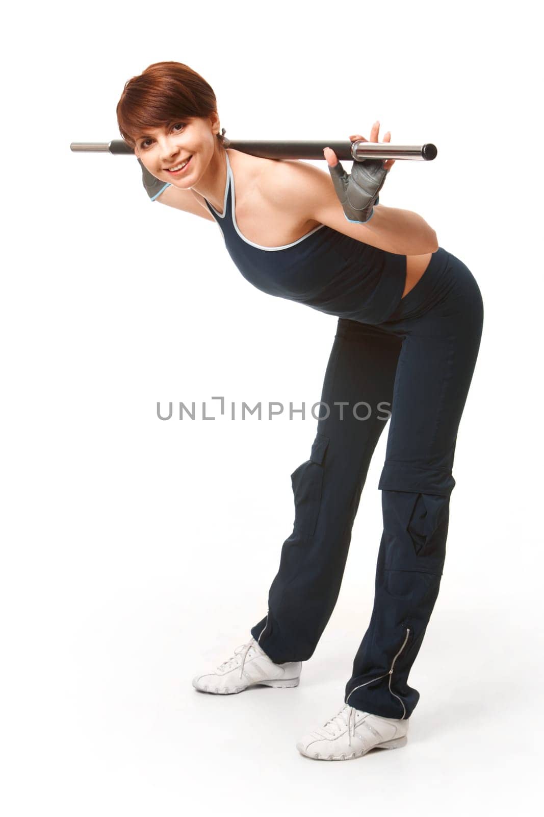 Image of smiling woman looking at camera while doing physical exercise