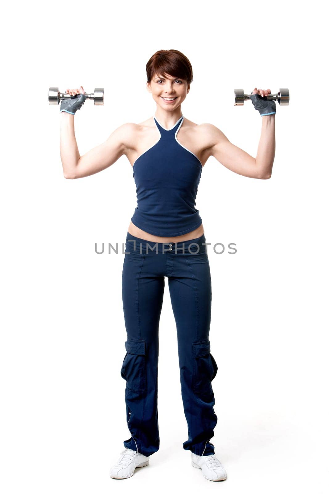 Image of smiling woman exercising with barbells in hands