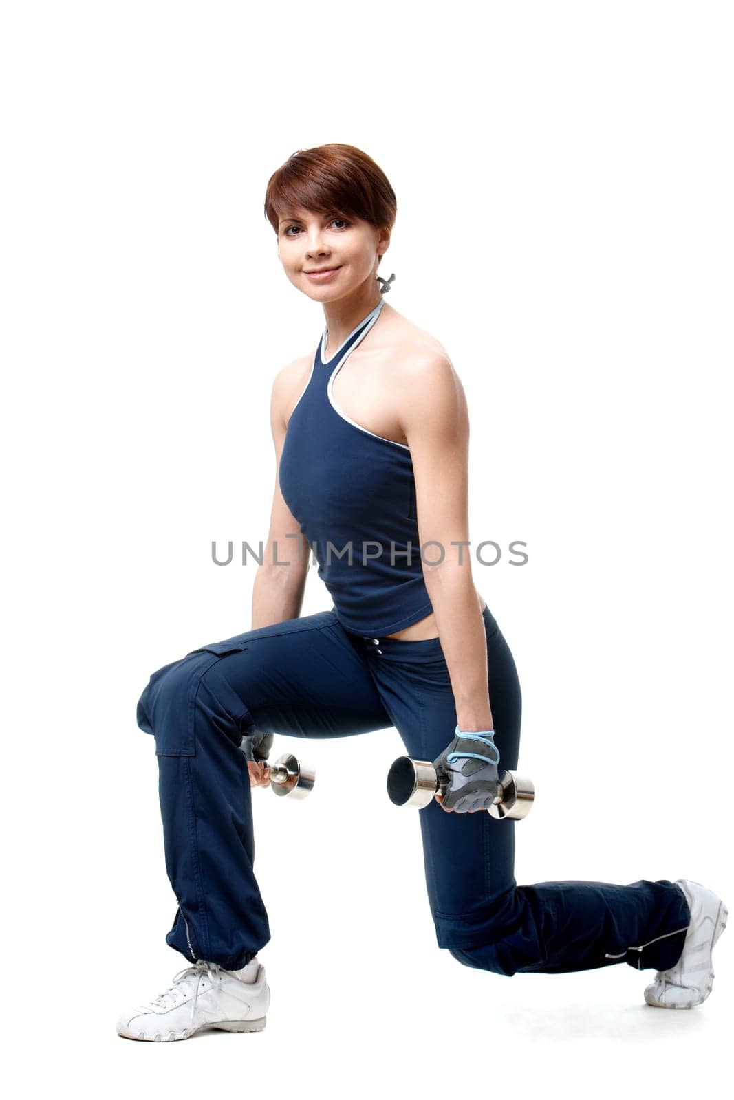 Image of smiling woman exercising with barbells in hands