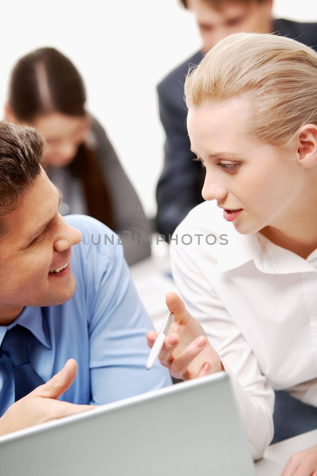 Businesswoman explaining work to businessman