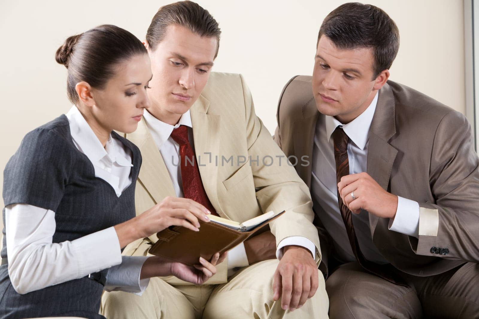 Portrait of confident business people interacting with each other in the office