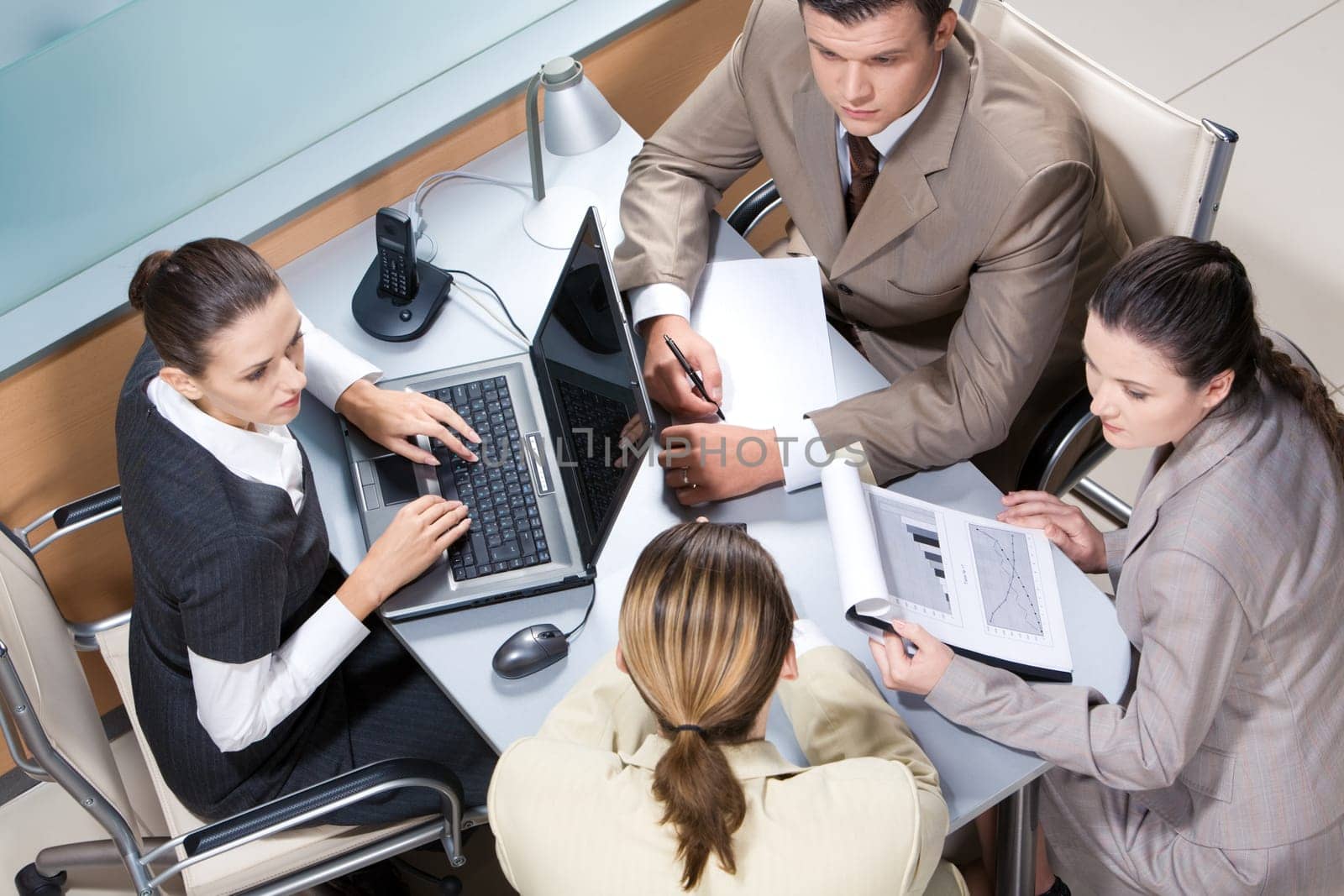 View from above of business team working at table in the office