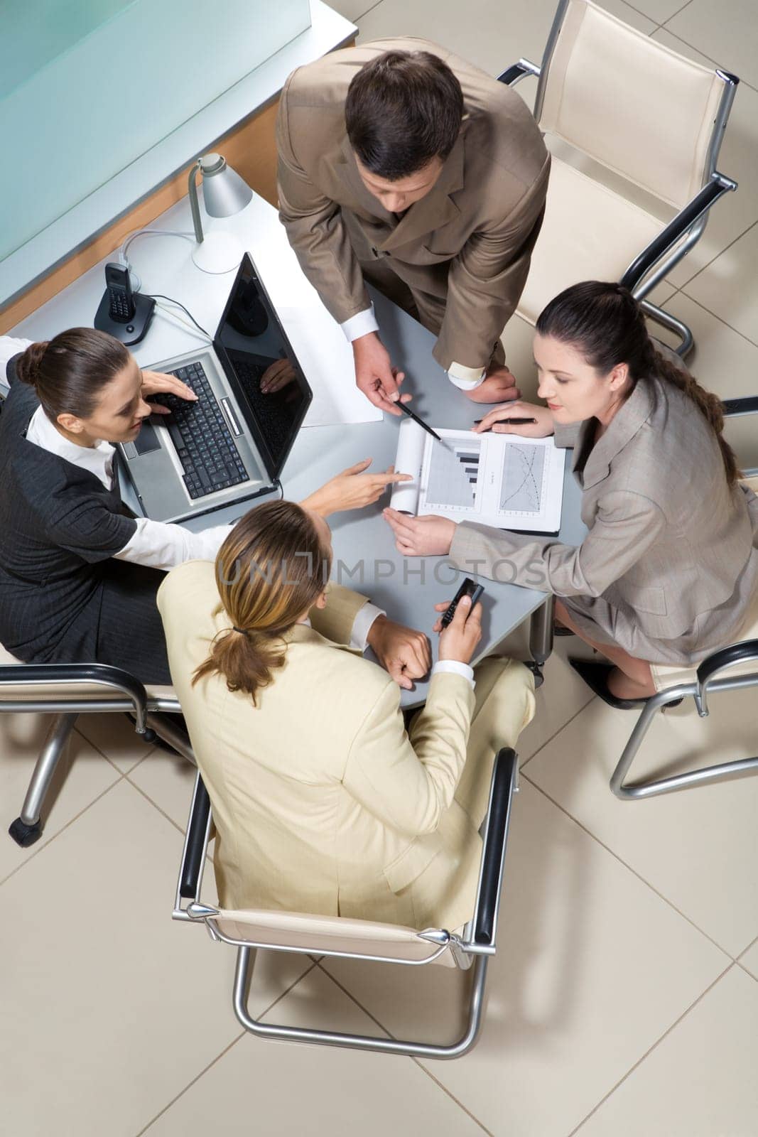 Portrait of businesspeople interacting and brainstorming together at meeting