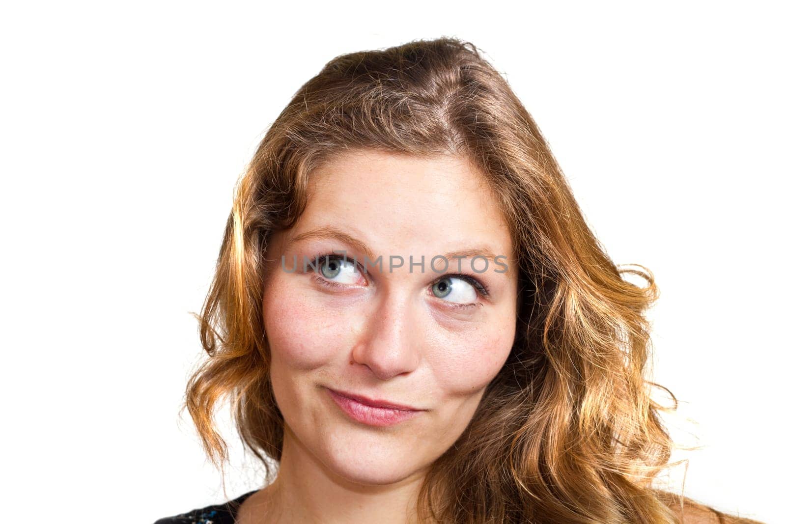Beautiful thoughtful woman looking up