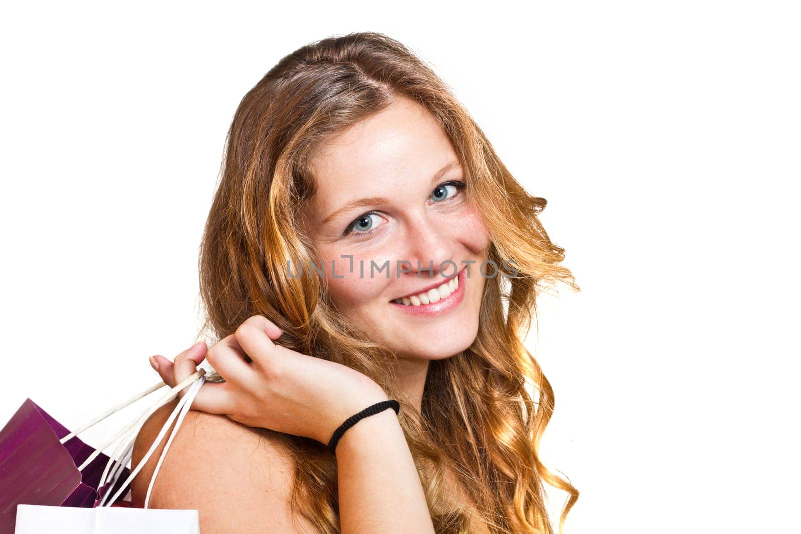 Close up happy shopping girl holding bags
