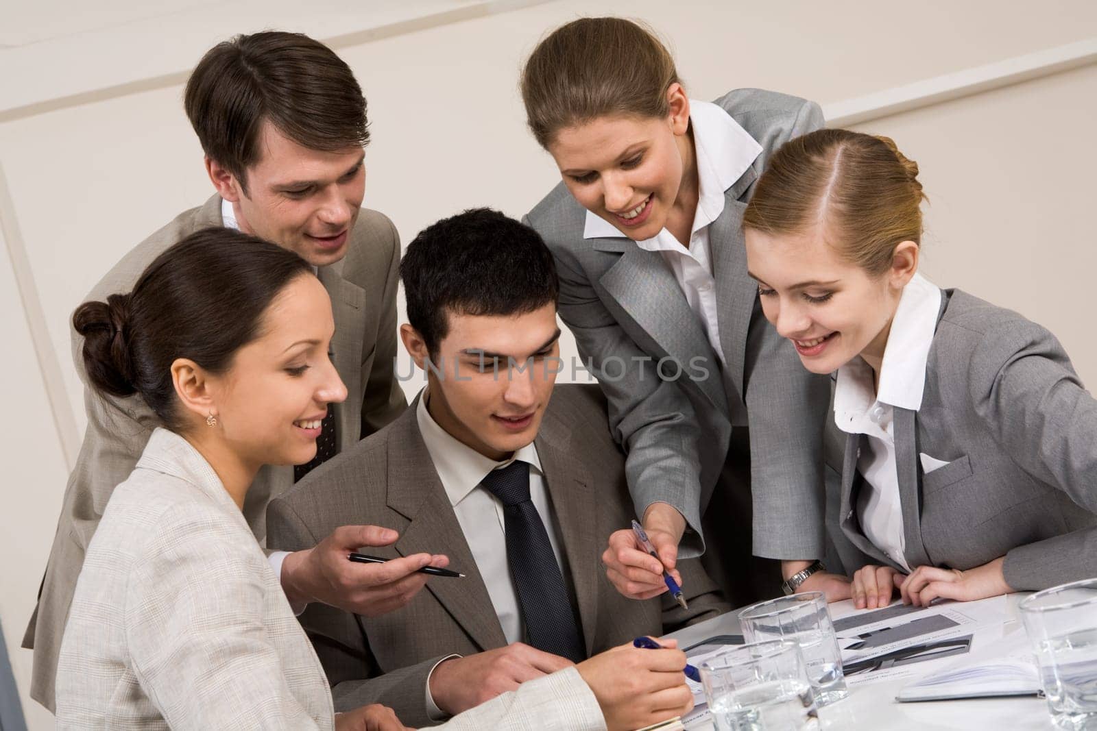 Portrait of busy people discussing new project or working plan