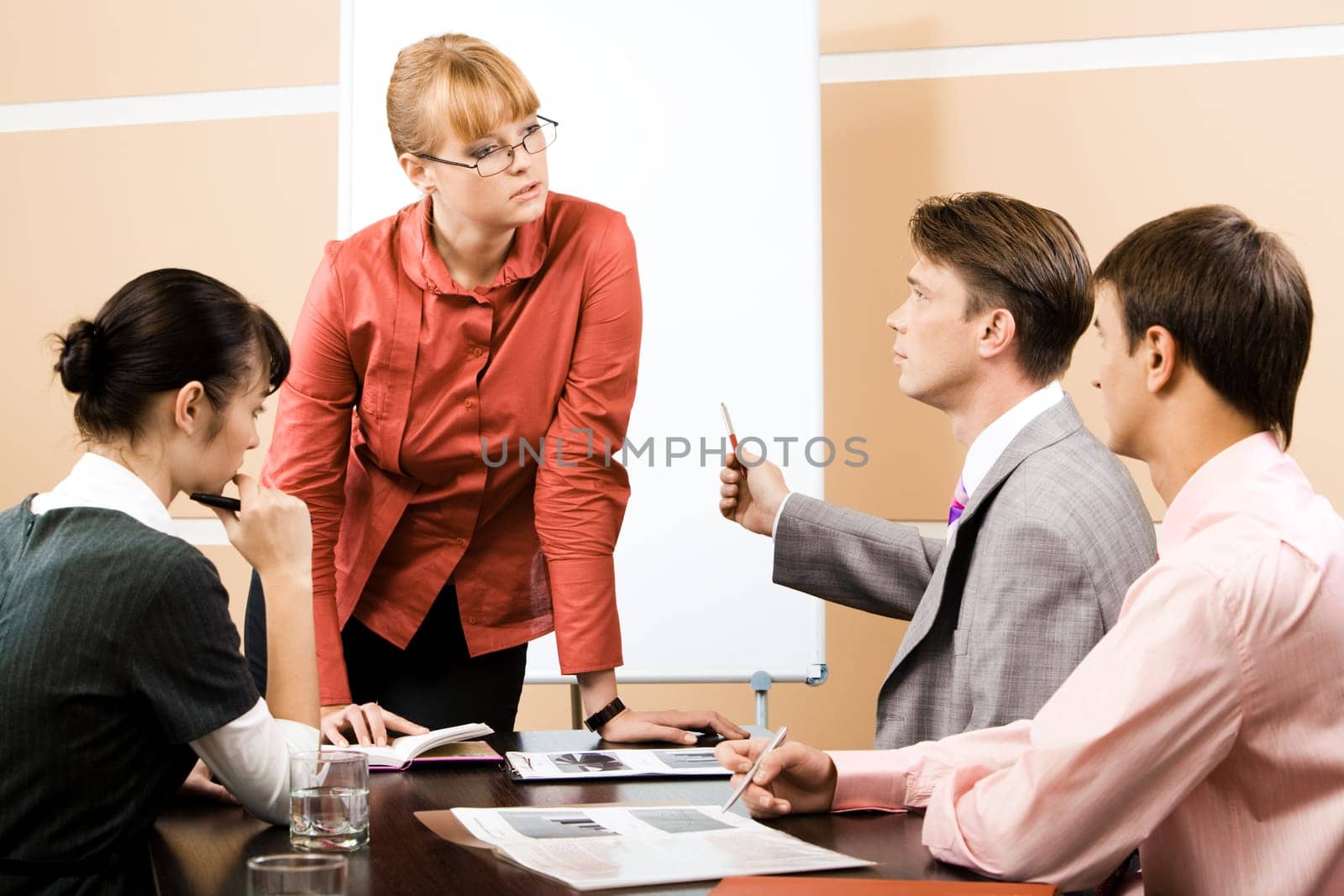 Teacher listening explanation of confident businessman at seminar