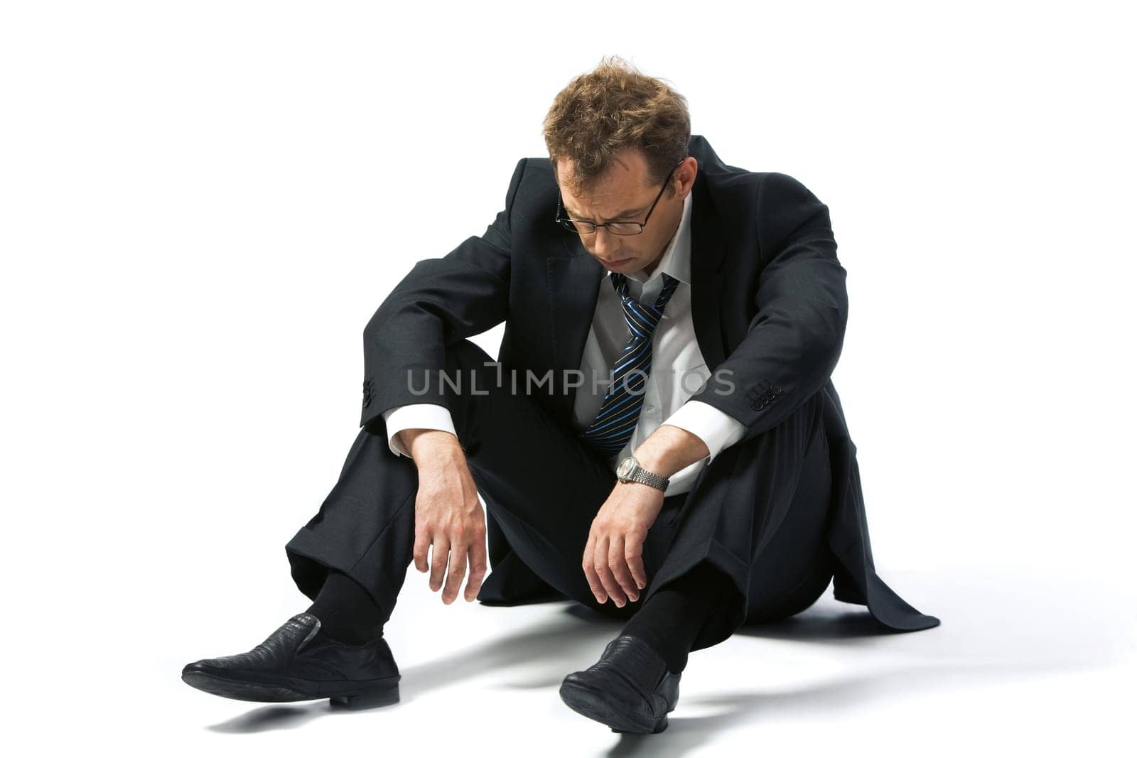 Portrait of stressed businessman left to the mercy of fate