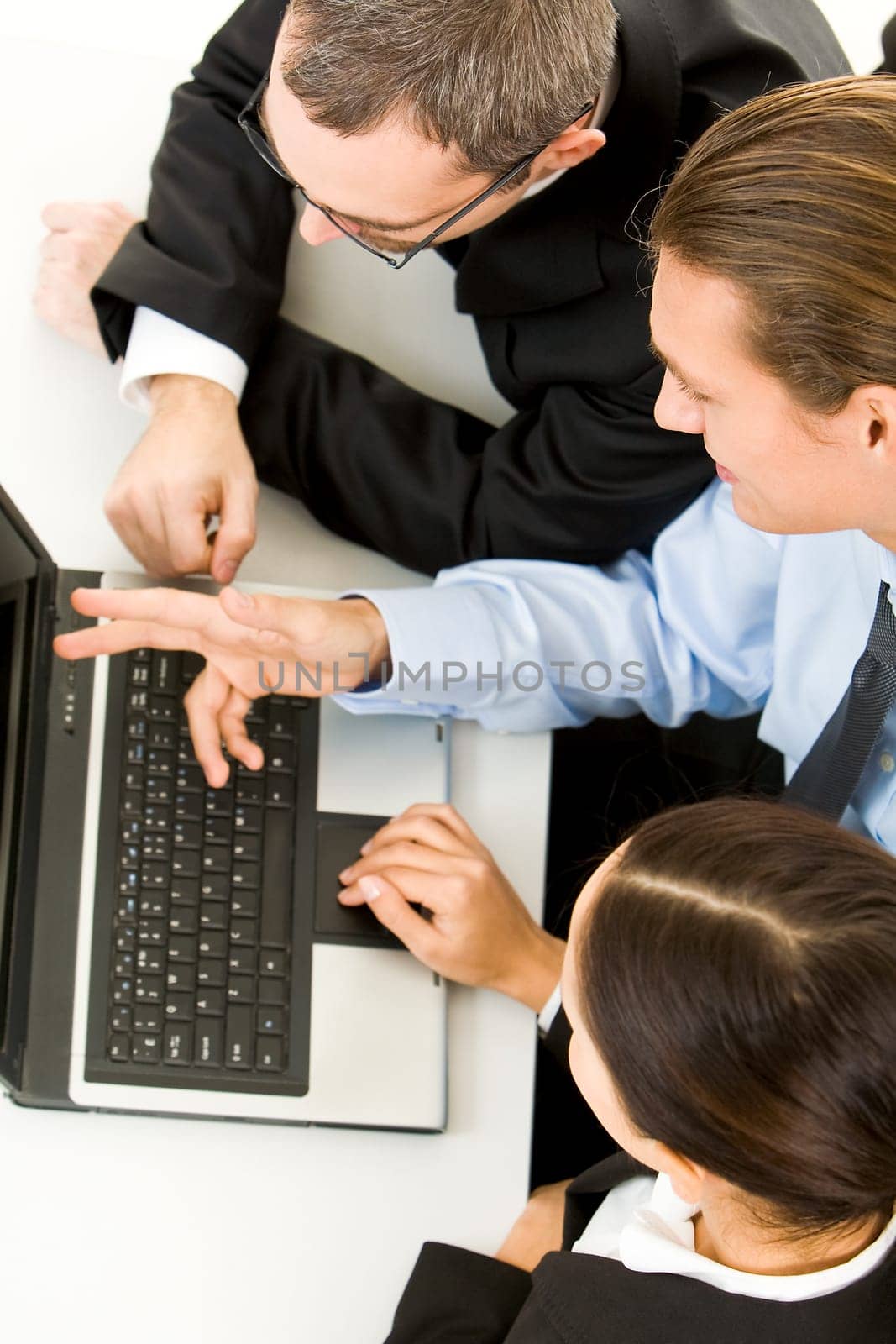 Above view of business people working with laptop