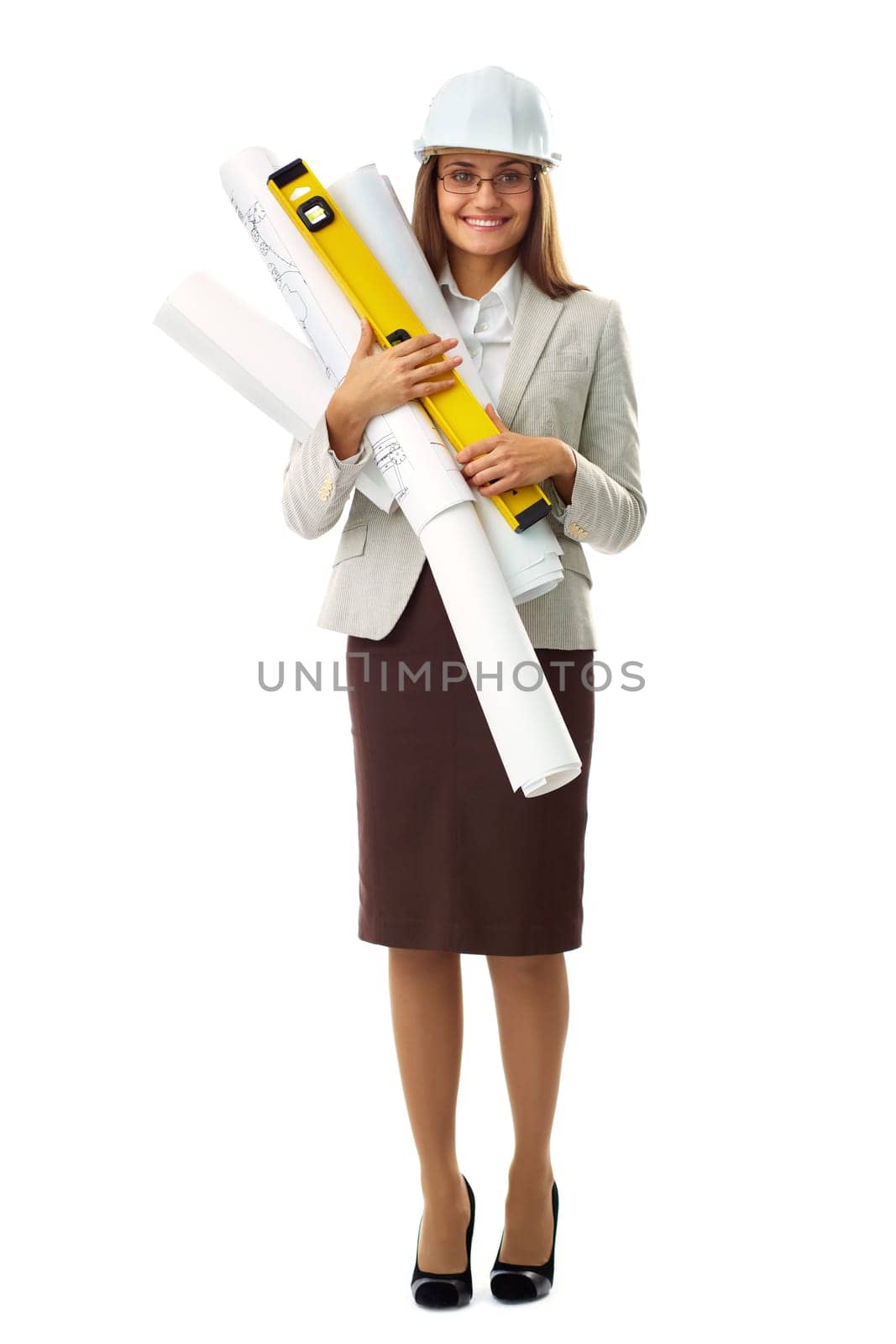 Portrait of elegant businesswoman in helmet holding rolled blueprints in isolation
