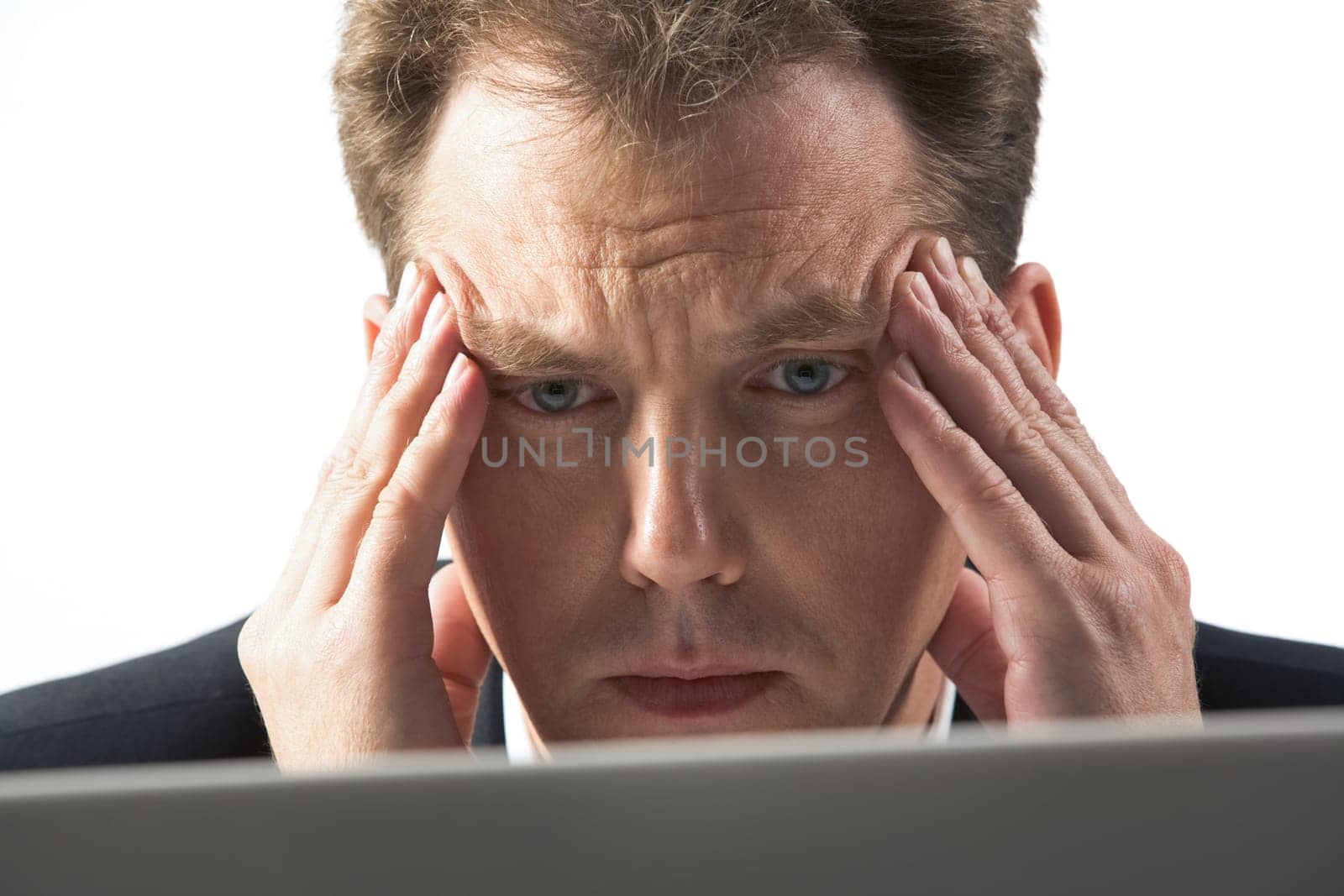 Photo of stressed businessman touching his head while thinking