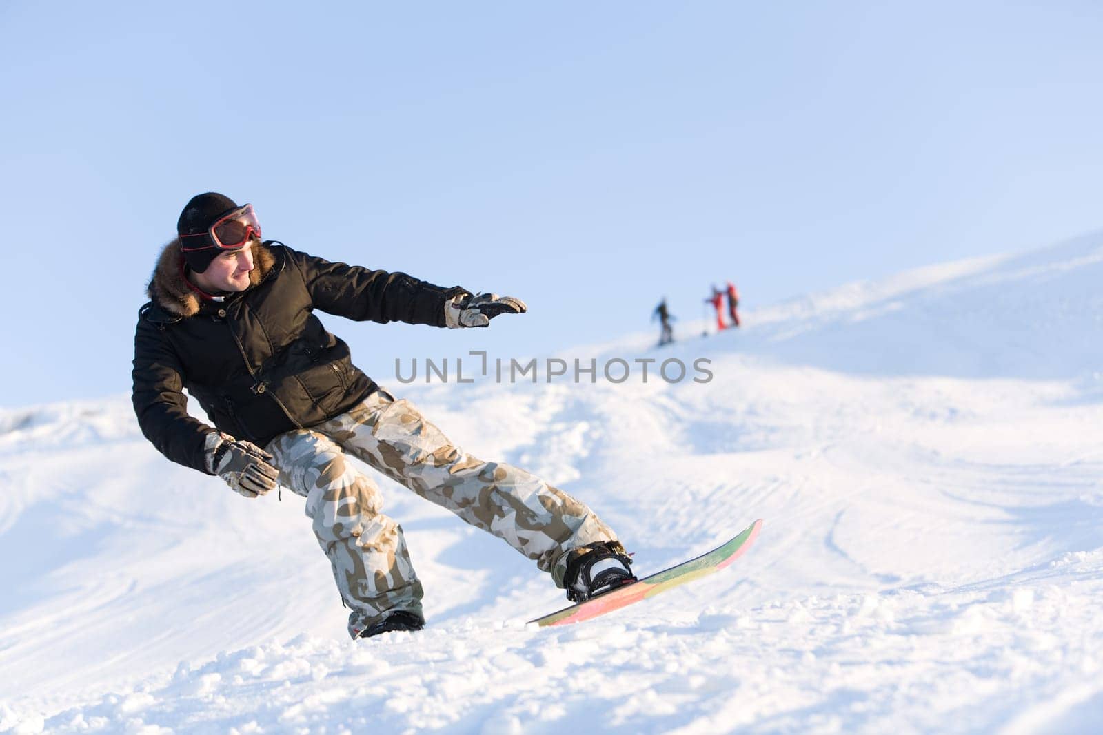 Image of sportsman go snowboarding at free time