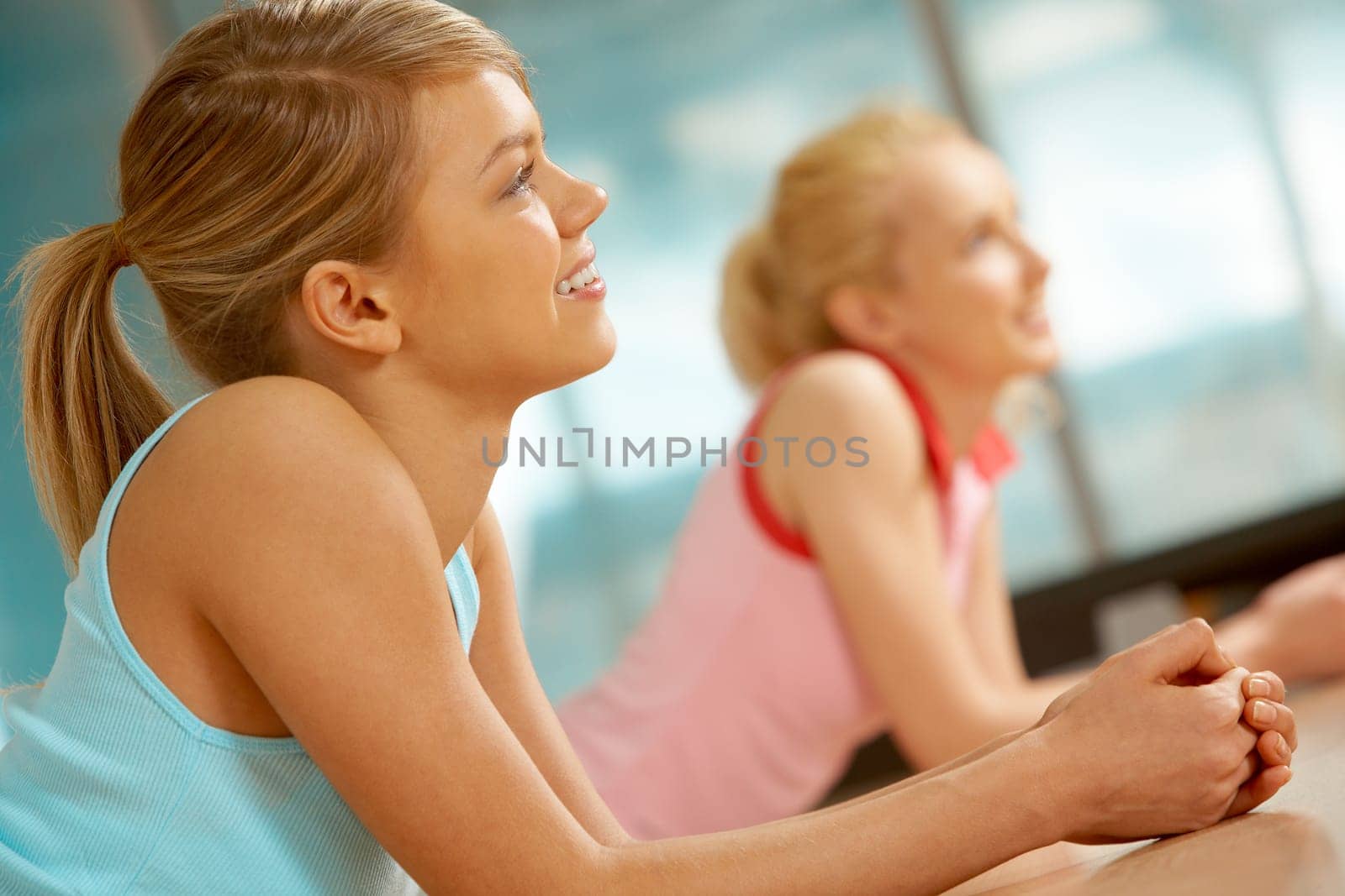 Photo of young girl lying on the floor in sports gym