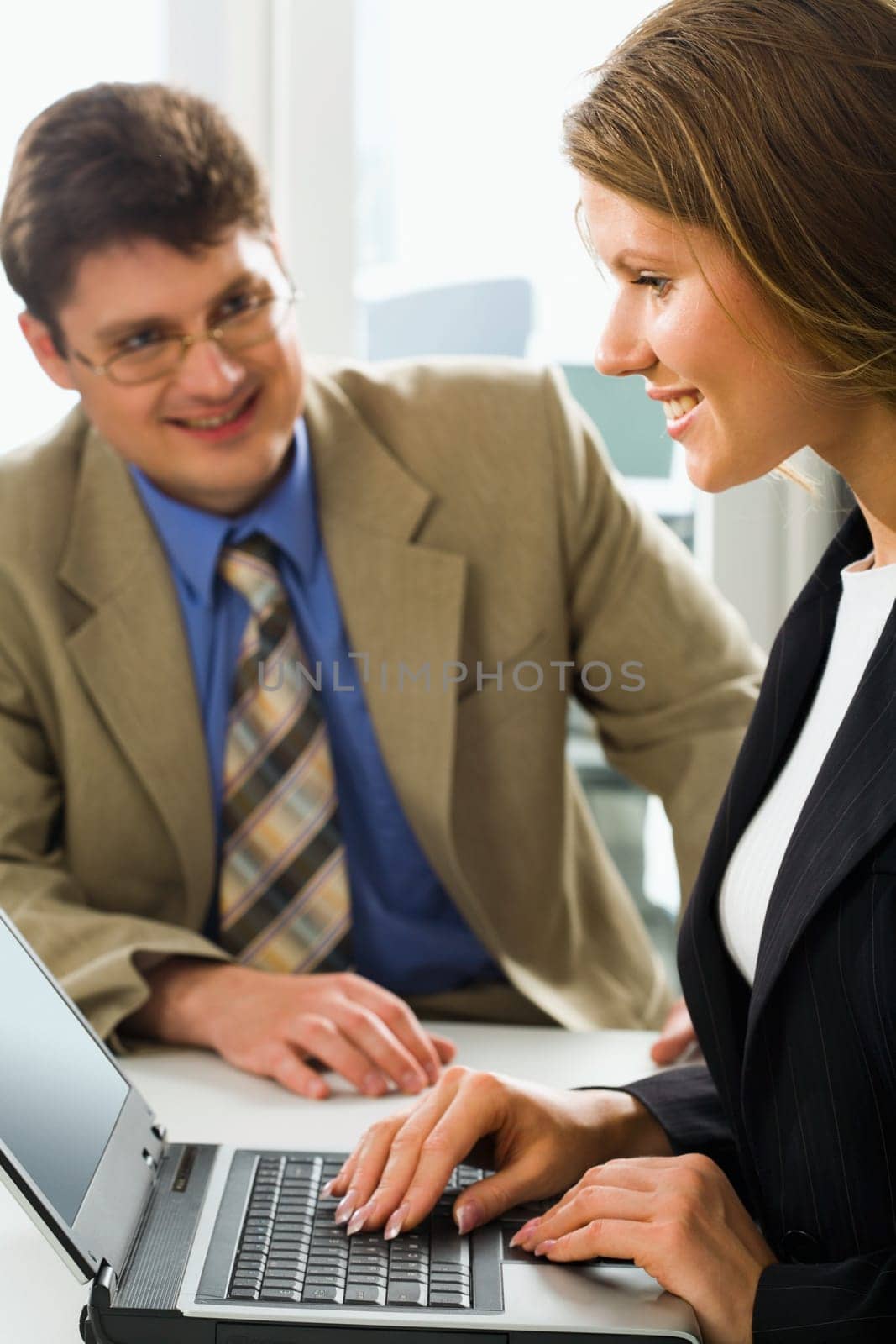 Successful business coach and his young beautiful female learner
