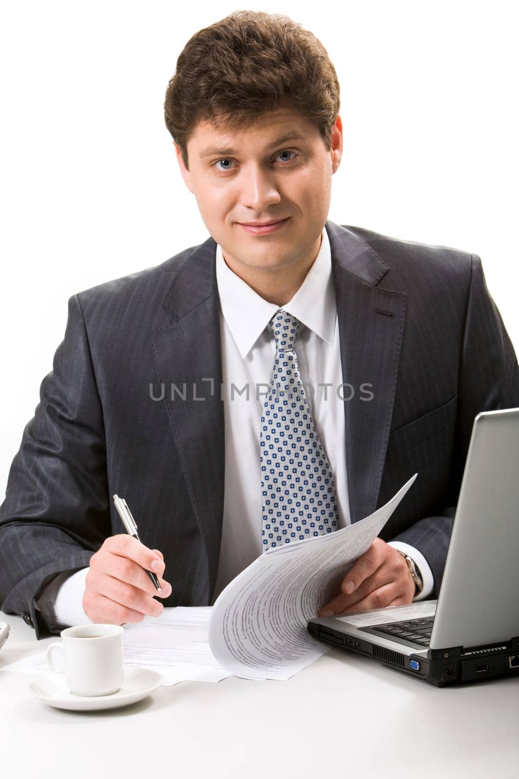 Portrait of confident businessman looking at camera during work planning