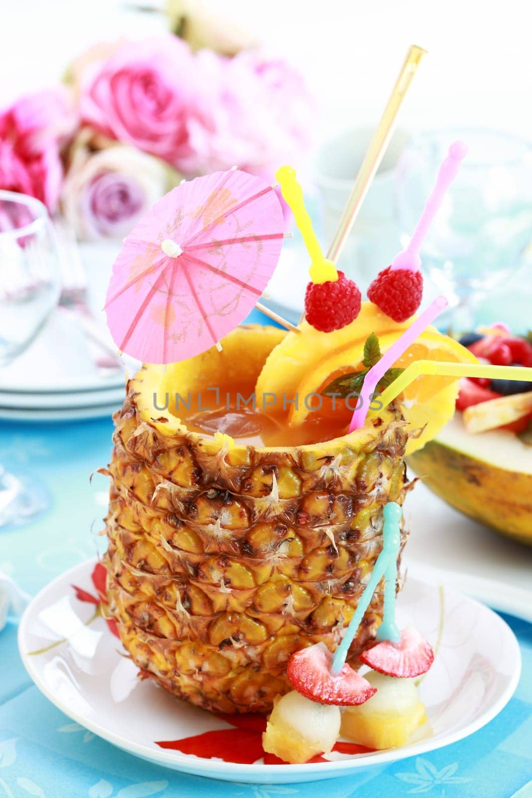 Summer cocktail served in pineapple