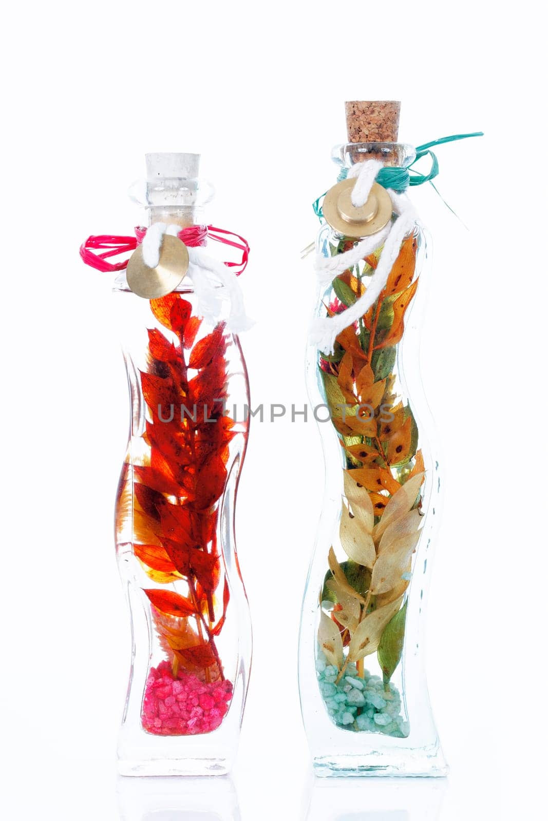Fresh natural spa scene with herb essences in glass bottles,