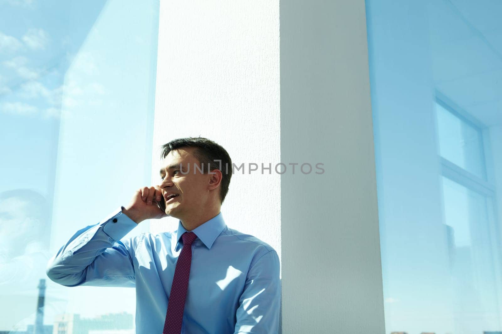 Portrait of handsome man calling by mobile phone