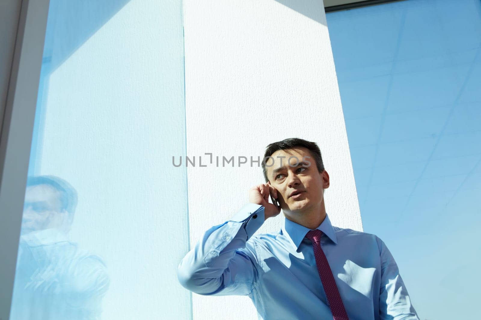 Portrait of handsome man calling by mobile phone