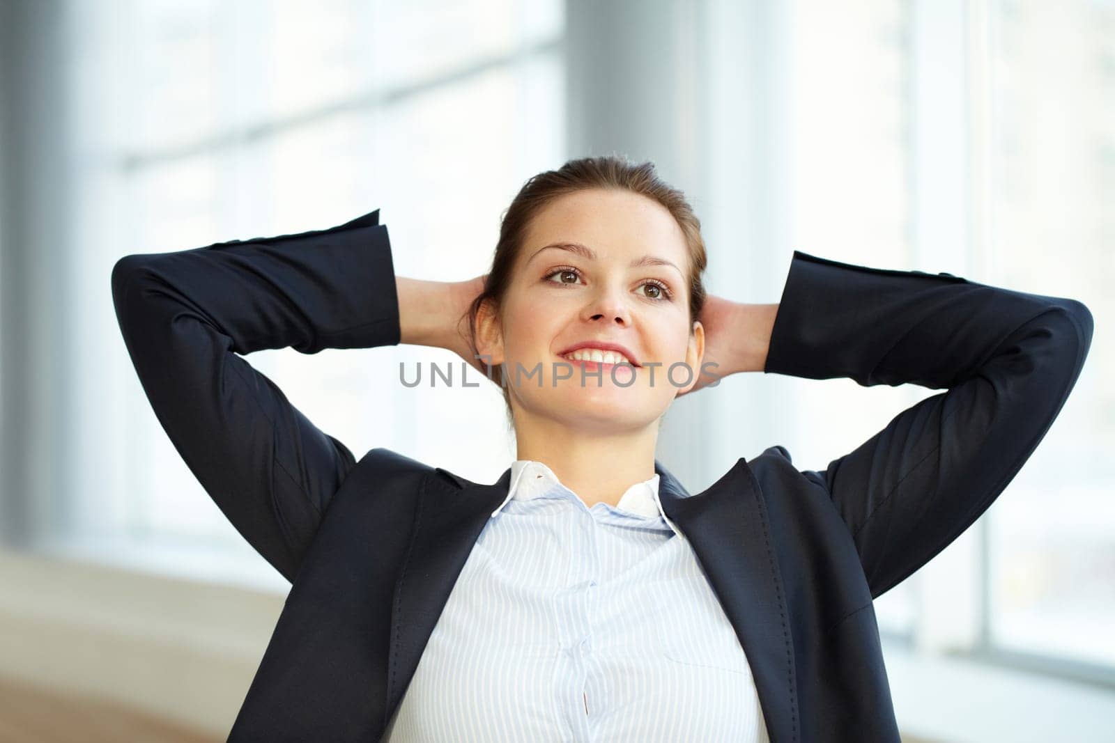 Portrait of a young businesswoman relaxing