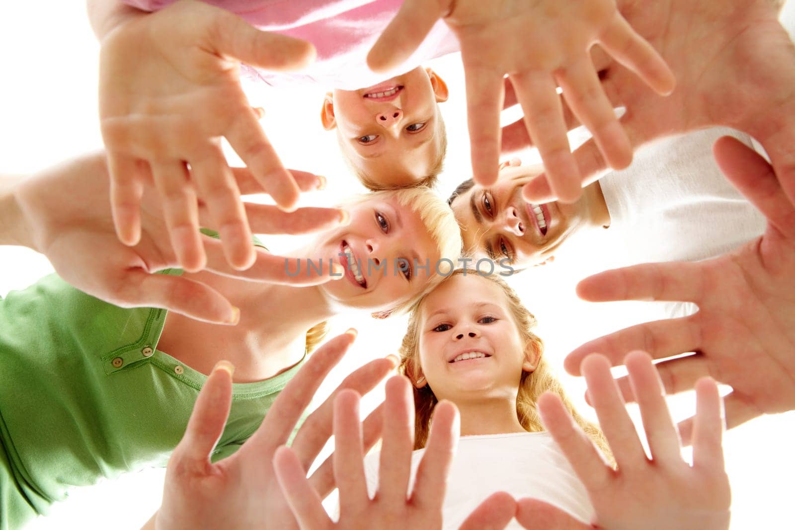 Below view of family members head by head and showing hands