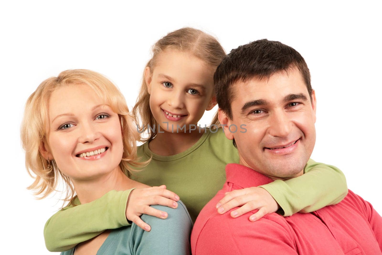 Portrait of happy parents being embraced by their daughter