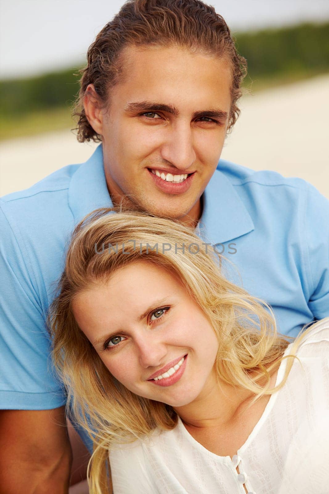 Photo of smiling girl and her boyfriend during vacation