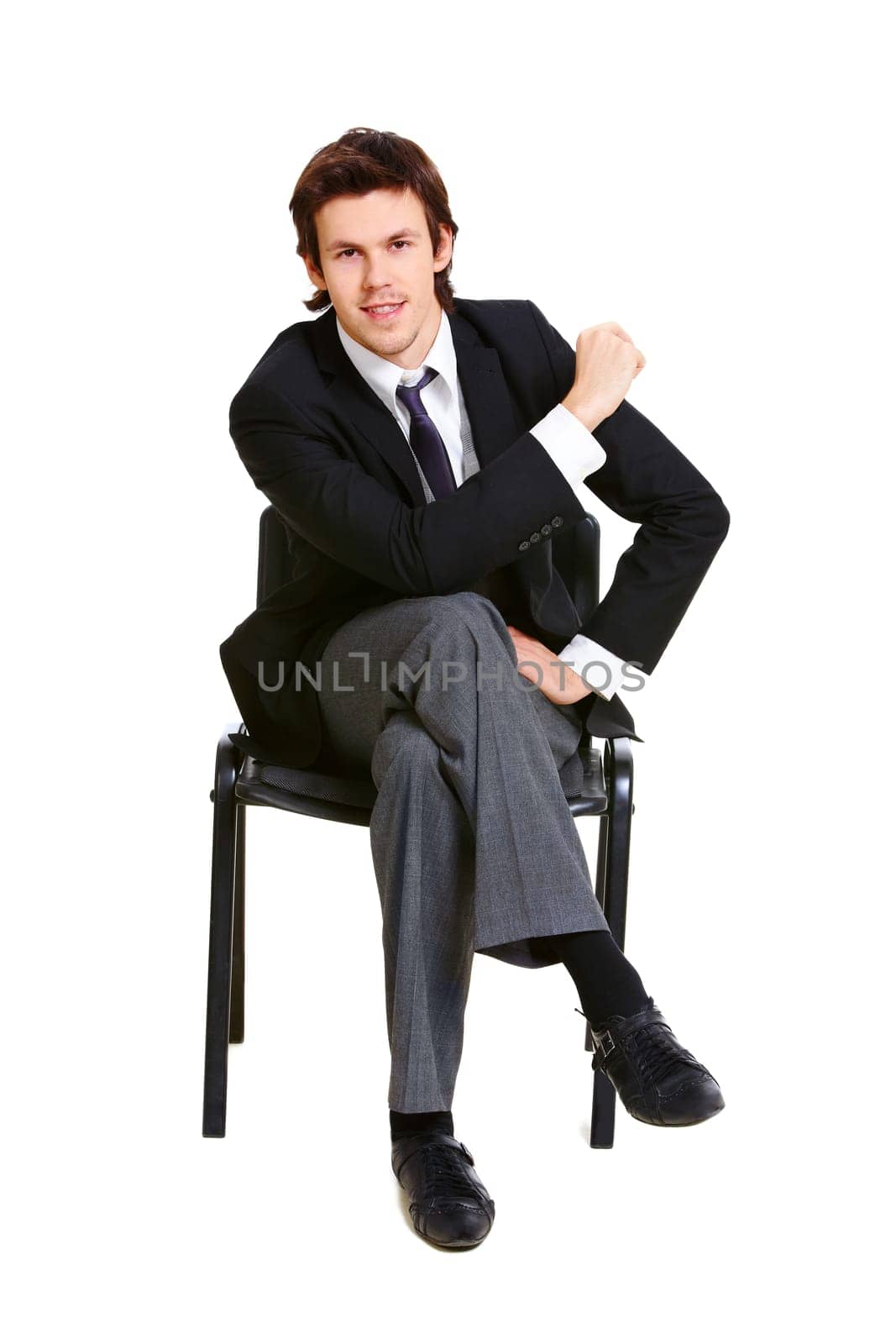 Image of successful businessman in elegant suit seated on chair