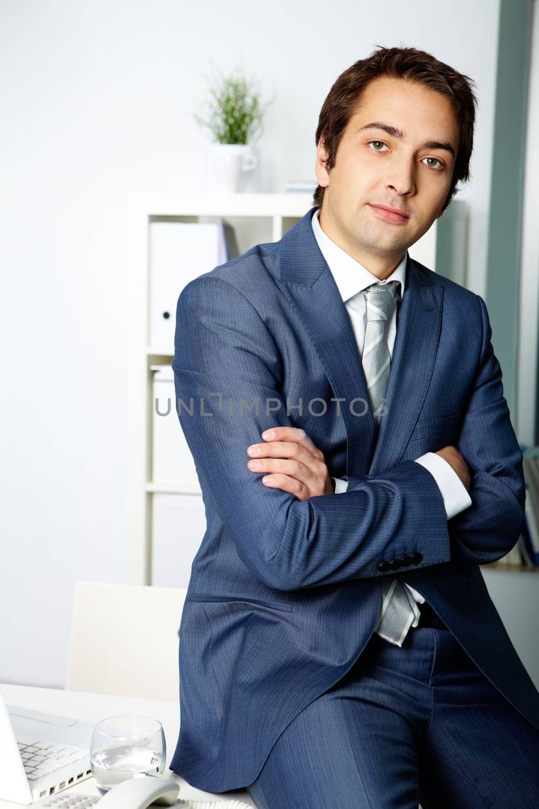 Portrait of a successful employer in formalwear looking at camera