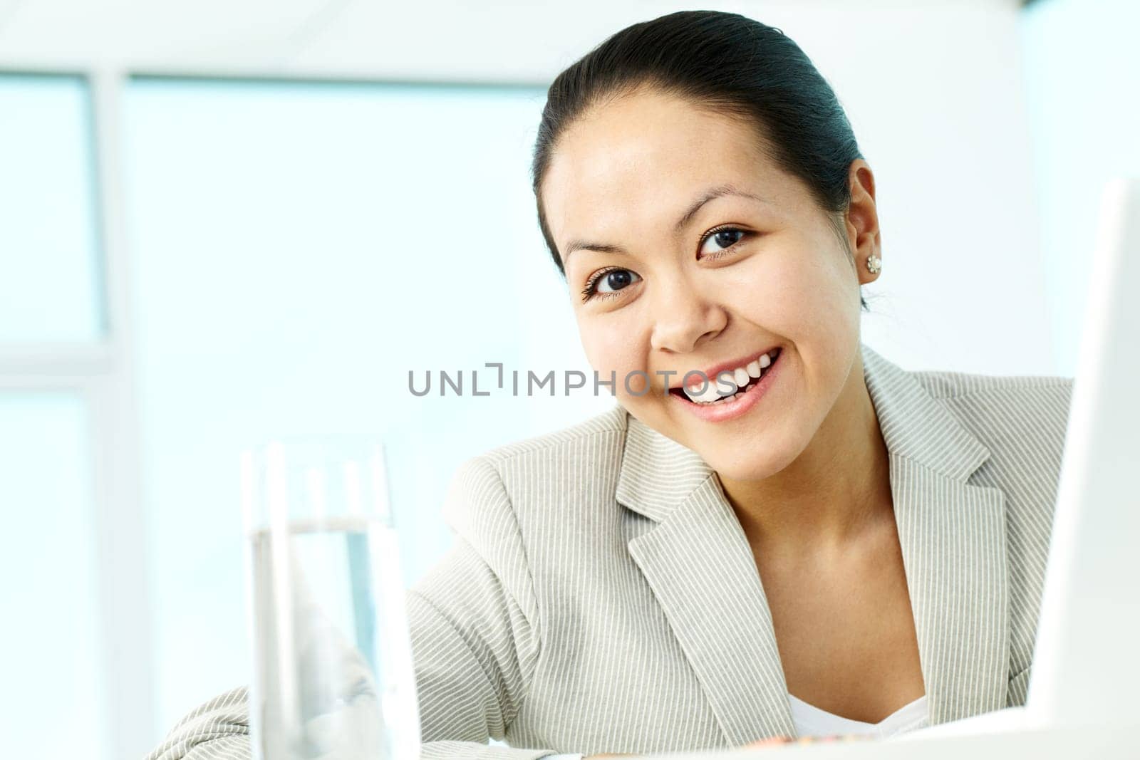 Portrait of smiling businesswoman looking at camera