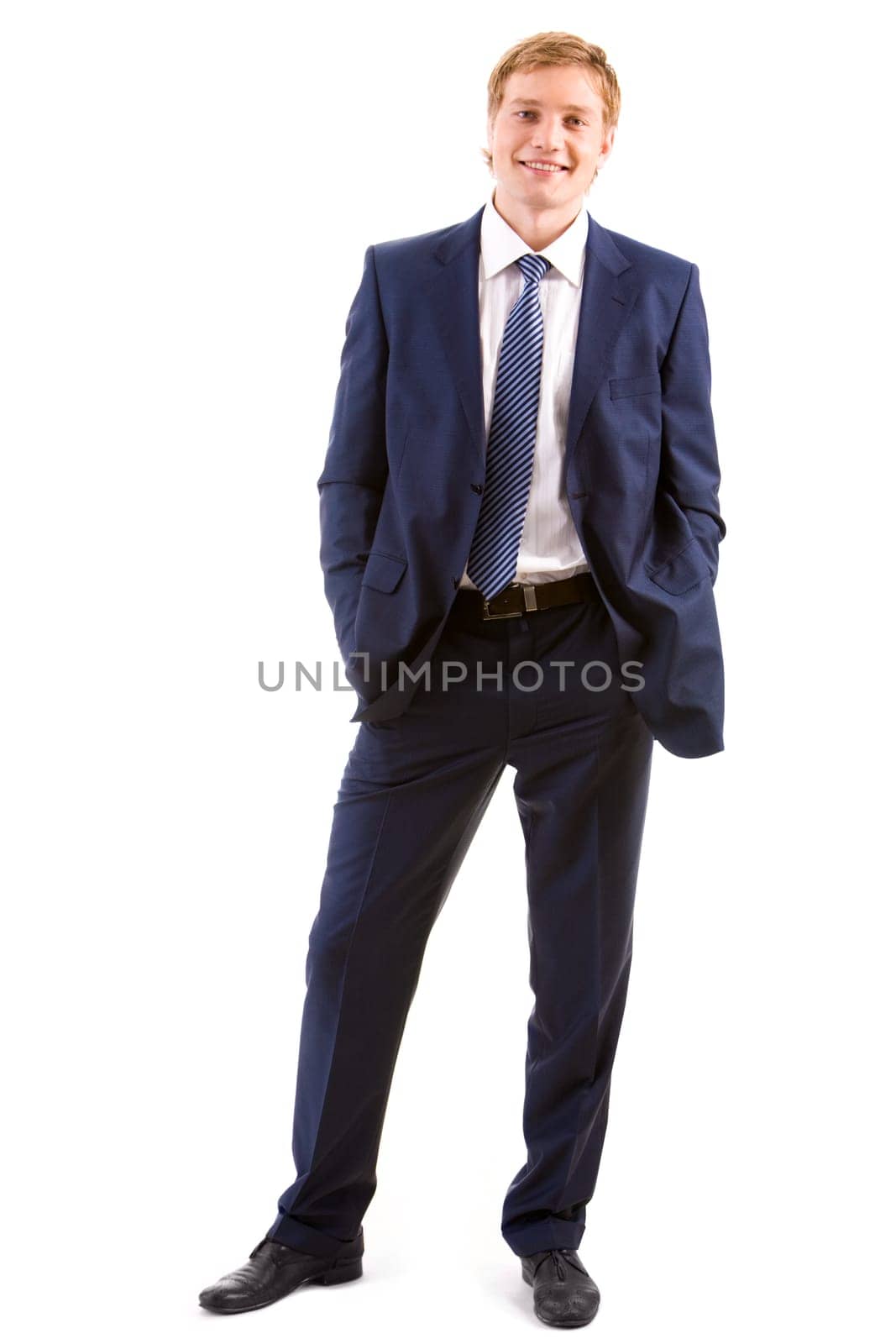 Vertical image of successful man standing in studio